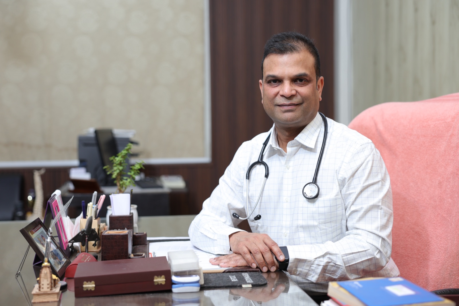 Dr Neeraj Jain at his consulting desk